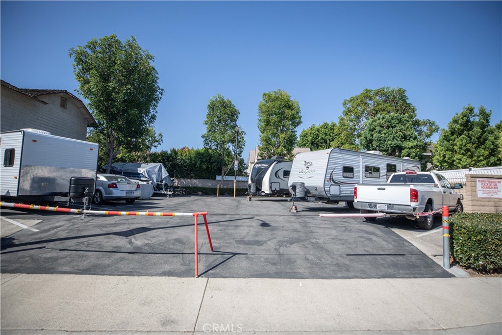 1117 Dennis Drive Costa Mesa, CA 92626 - Photo 44 of 44 a front view of a house with a garden and parking