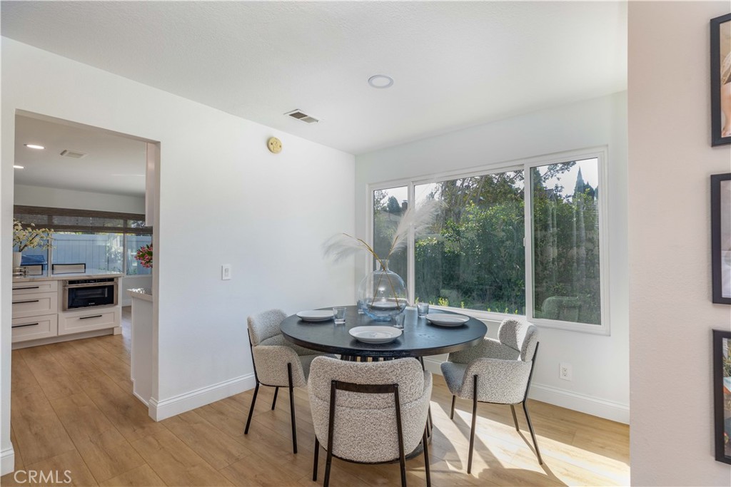 1117 Dennis Drive Costa Mesa, CA 92626 - Photo 5 of 44 a view of a dining room with furniture window and wooden floor