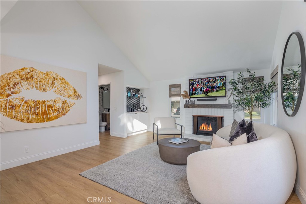 1117 Dennis Drive Costa Mesa, CA 92626 - Photo 9 of 44 a living room with furniture and a fireplace