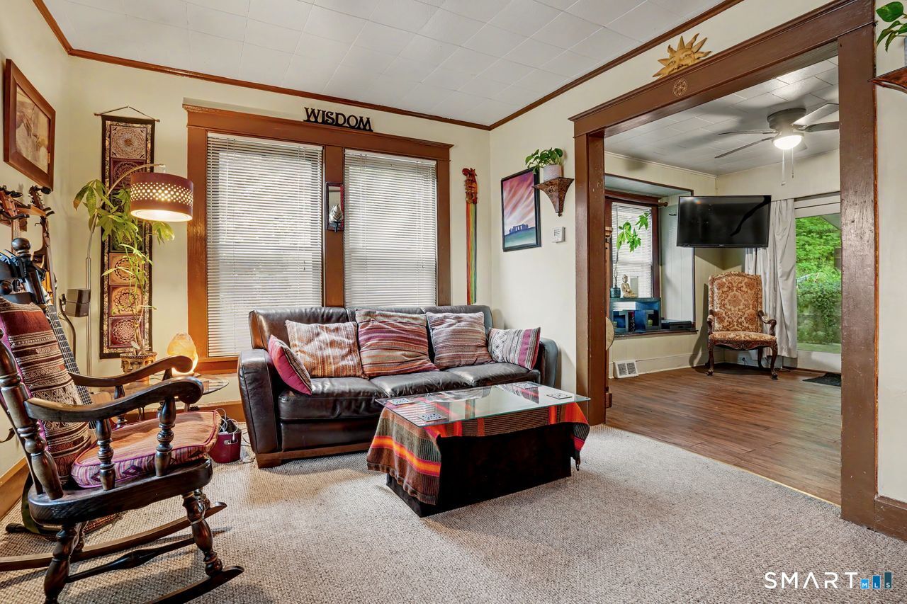 74 Maple Street Seymour, CT 06483 - Photo 10 of 40 a living room with furniture and a large window