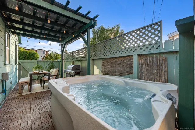 a view of a backyard with sitting area