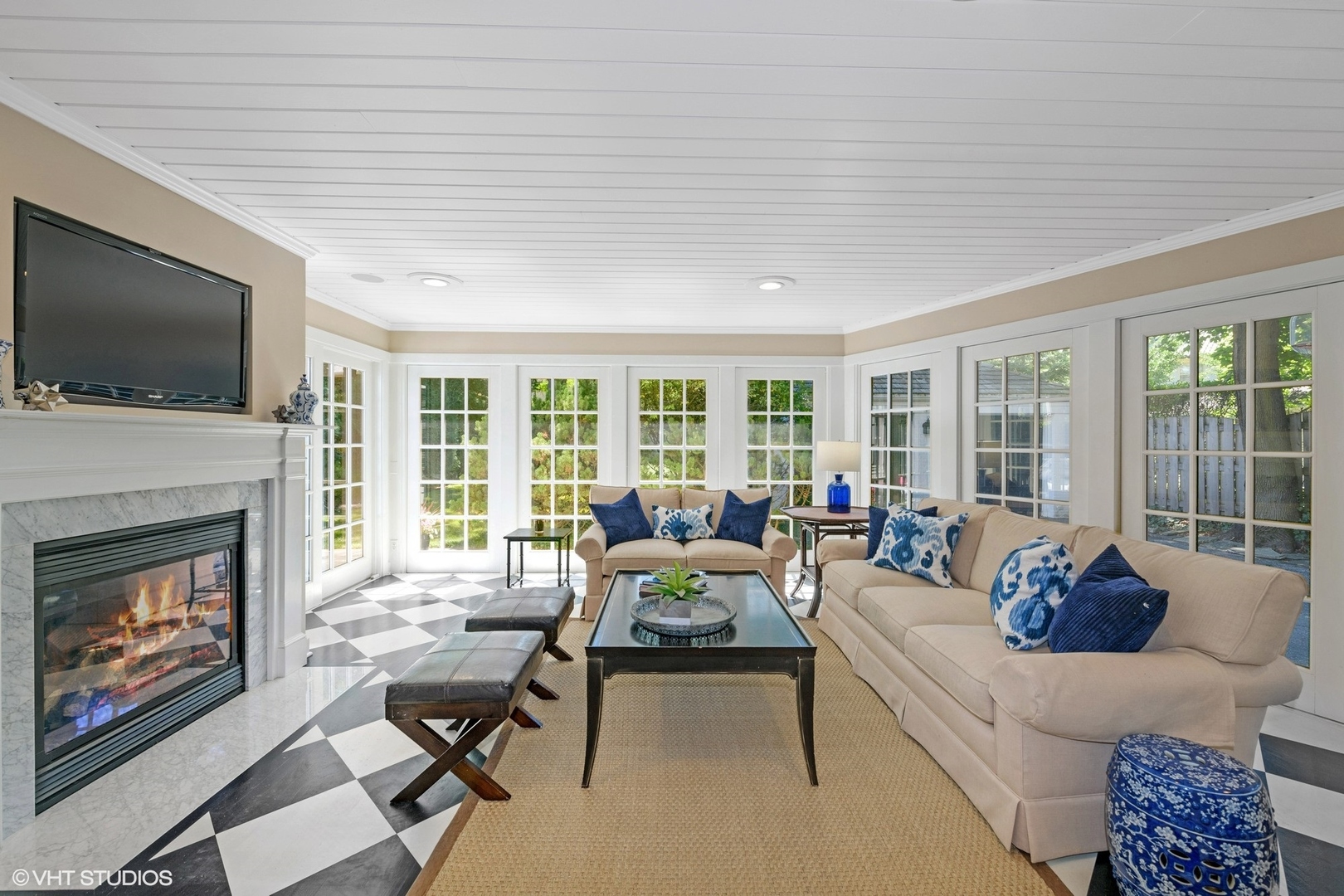 200 Sheridan Road Winnetka, IL 60093 - Photo 2 of 28 a living room with furniture a flat screen tv and a fireplace