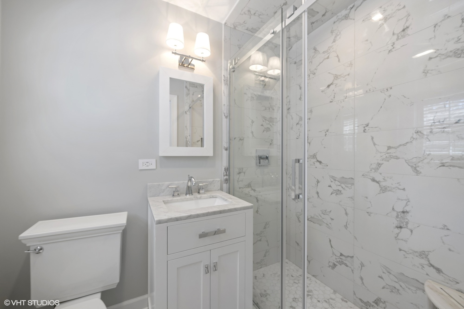200 Sheridan Road Winnetka, IL 60093 - Photo 16 of 28 a bathroom with a sink a toilet and shower
