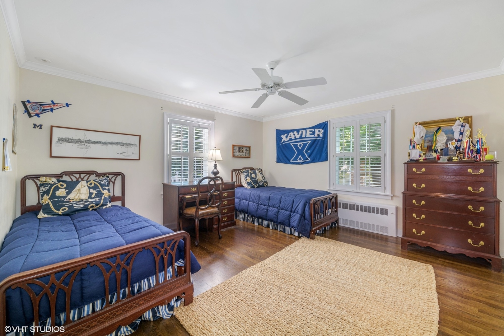 200 Sheridan Road Winnetka, IL 60093 - Photo 17 of 28 a bedroom with a bed a dresser and paintings on the wall