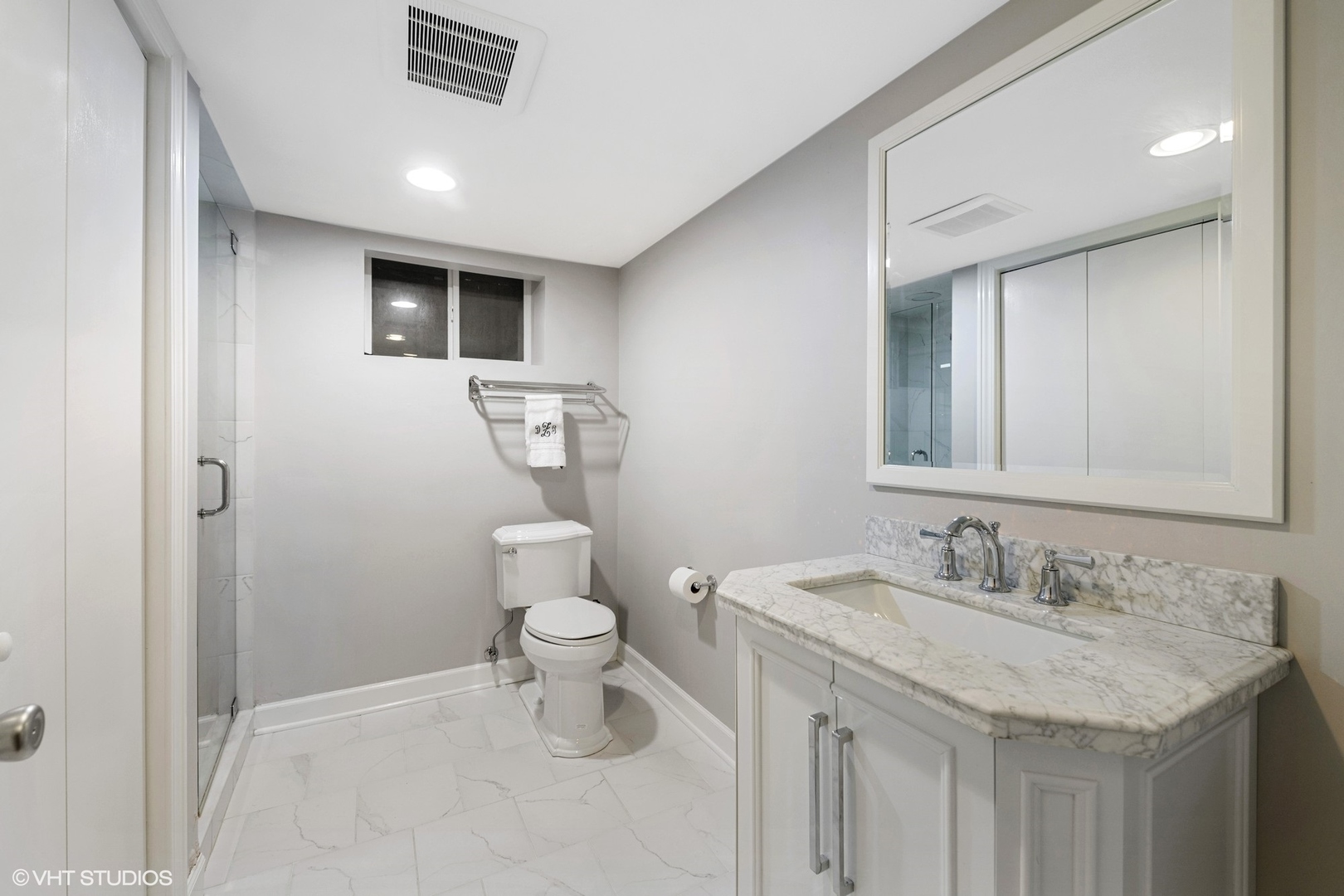 200 Sheridan Road Winnetka, IL 60093 - Photo 23 of 28 a bathroom with a granite countertop sink a toilet and a mirror