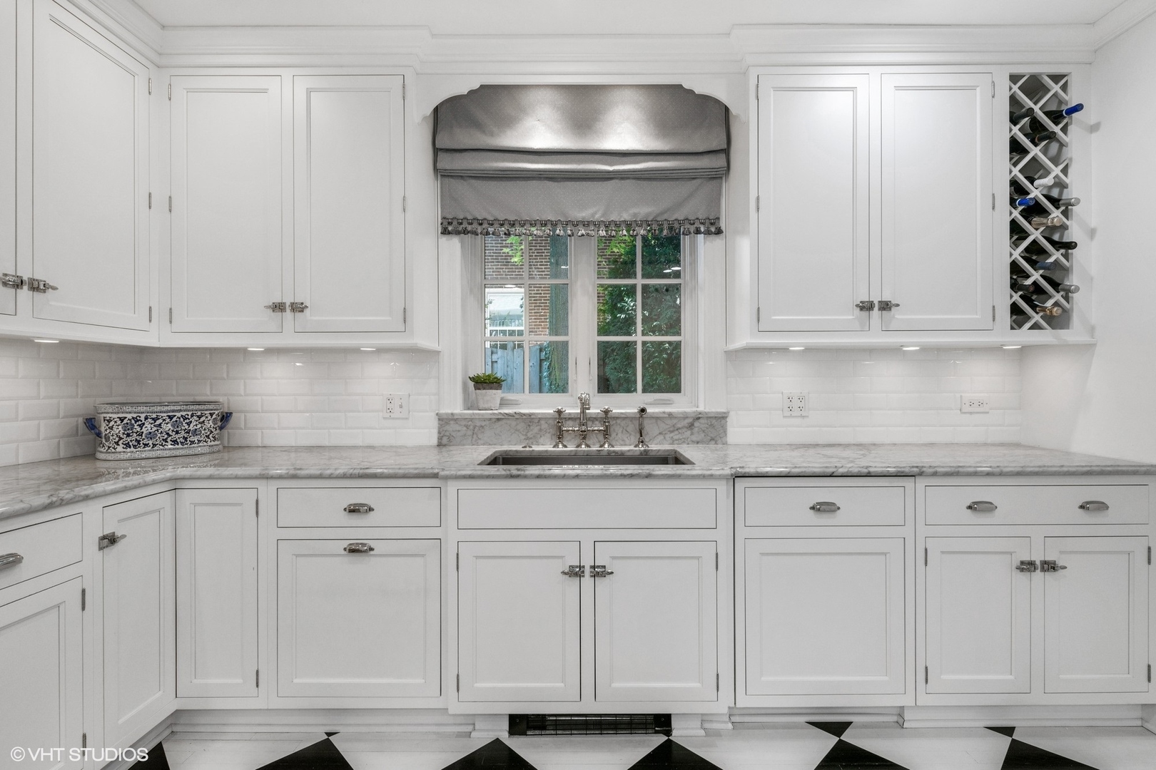 200 Sheridan Road Winnetka, IL 60093 - Photo 5 of 28 a kitchen with white cabinets and sink