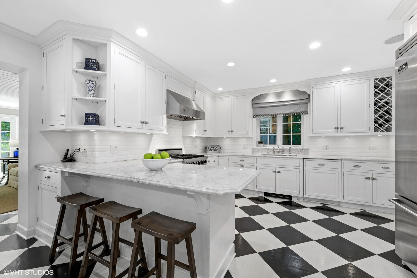 200 Sheridan Road Winnetka, IL 60093 - Photo 6 of 28 a kitchen with a checkered floor and white cabinets