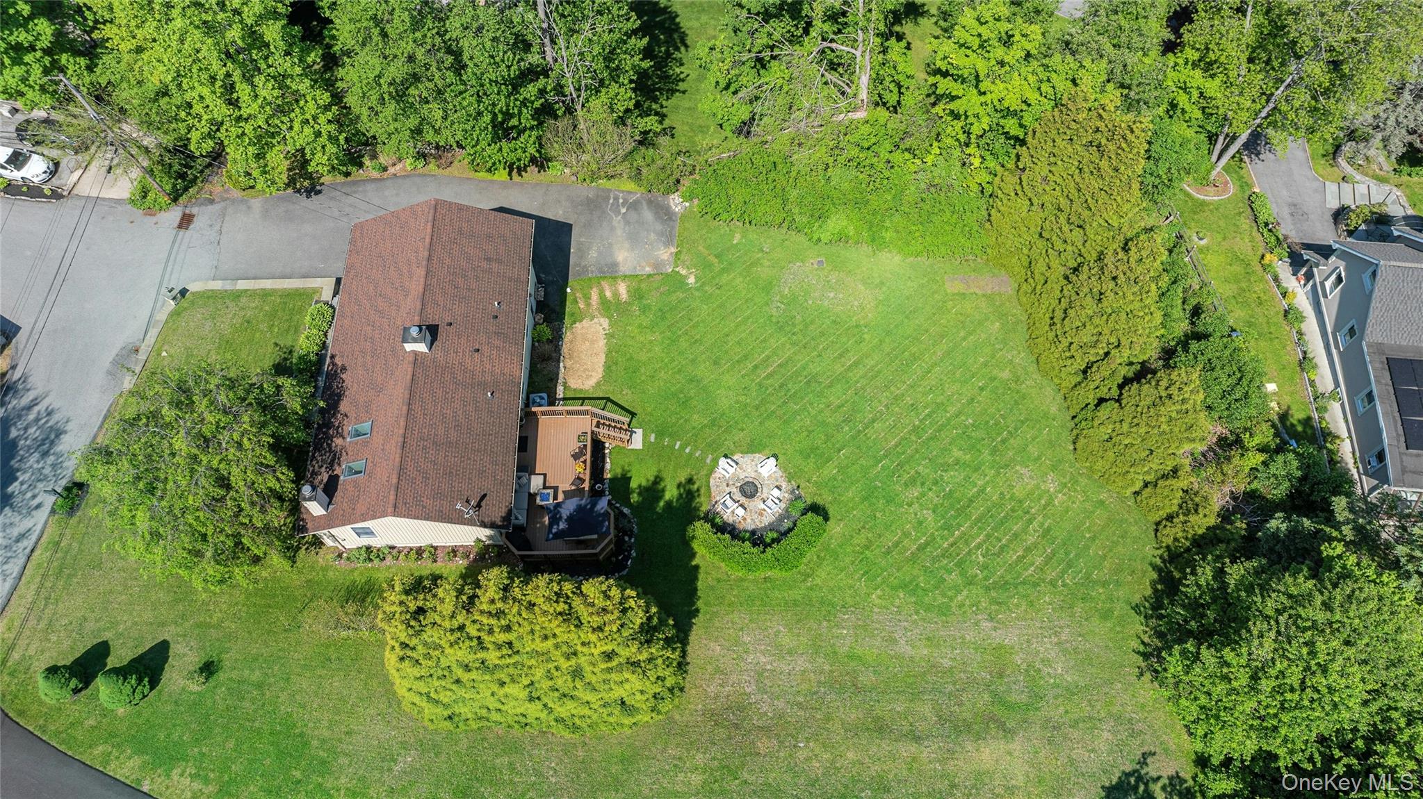 340 Osceola Road Jefferson Valley, NY 10535 - Photo 40 of 48 an aerial view of a house with a yard