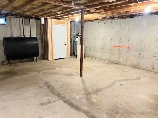 a view of a utility room with wooden walls