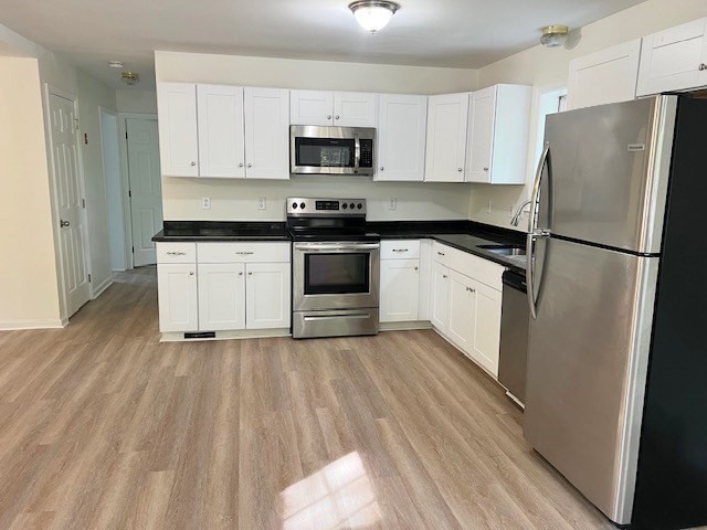 34 Kent Road Westminster, MA 01473 - Photo 5 of 27 a kitchen with a refrigerator stove and microwave