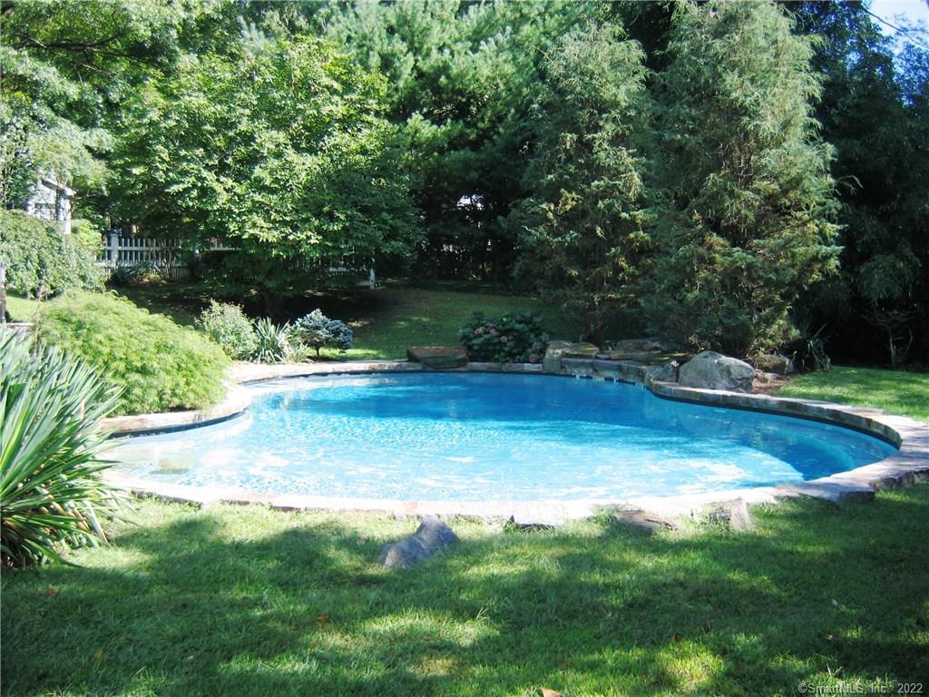 a view of swimming pool with a yard