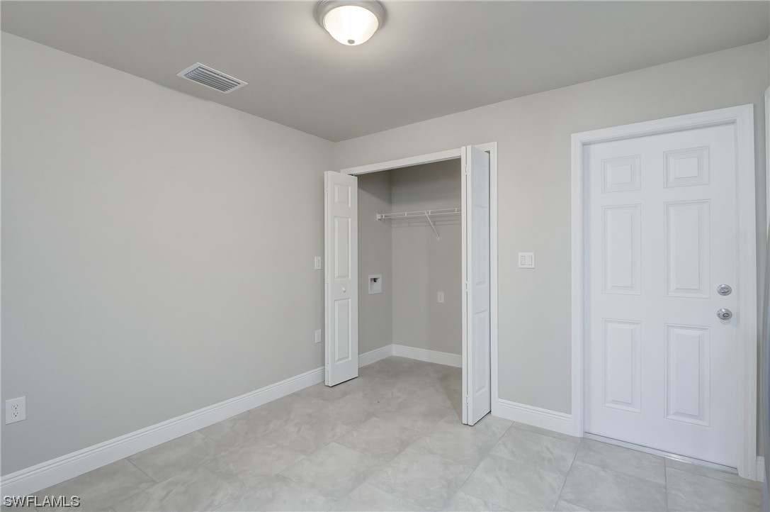 3215 46th Street West Lehigh Acres, FL 33971 - Photo 15 of 50 an empty room with closet area