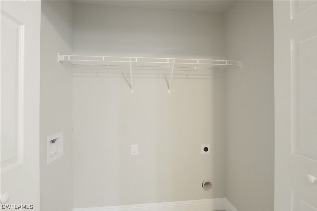 3215 46th Street West Lehigh Acres, FL 33971 - Photo 16 of 50 a bathroom with a glass shower door