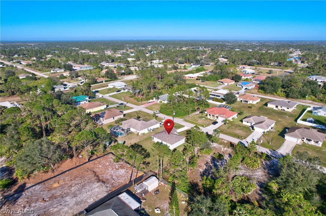 3215 46th Street West Lehigh Acres, FL 33971 - Photo 44 of 50 an aerial view of residential houses with outdoor space