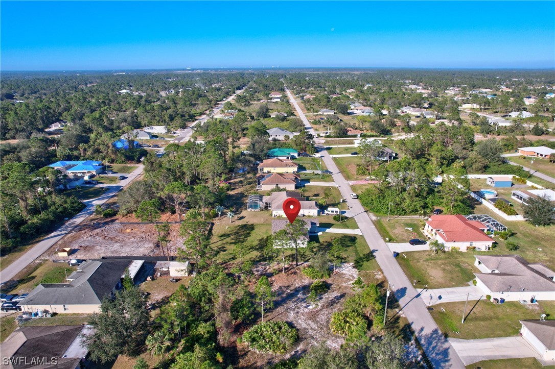 3215 46th Street West Lehigh Acres, FL 33971 - Photo 45 of 50 an aerial view of residential houses with outdoor space