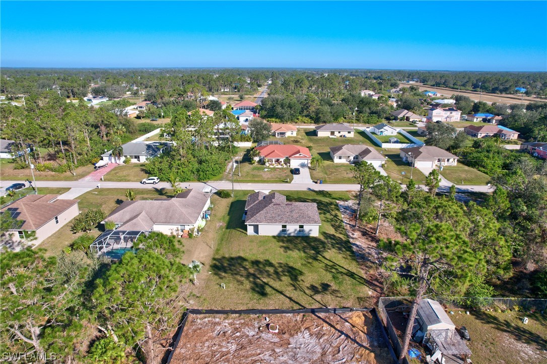 3215 46th Street West Lehigh Acres, FL 33971 - Photo 49 of 50 an aerial view of residential houses with outdoor space