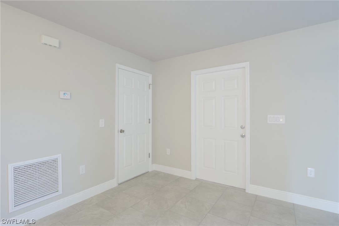 3215 46th Street West Lehigh Acres, FL 33971 - Photo 5 of 50 a view of an empty room