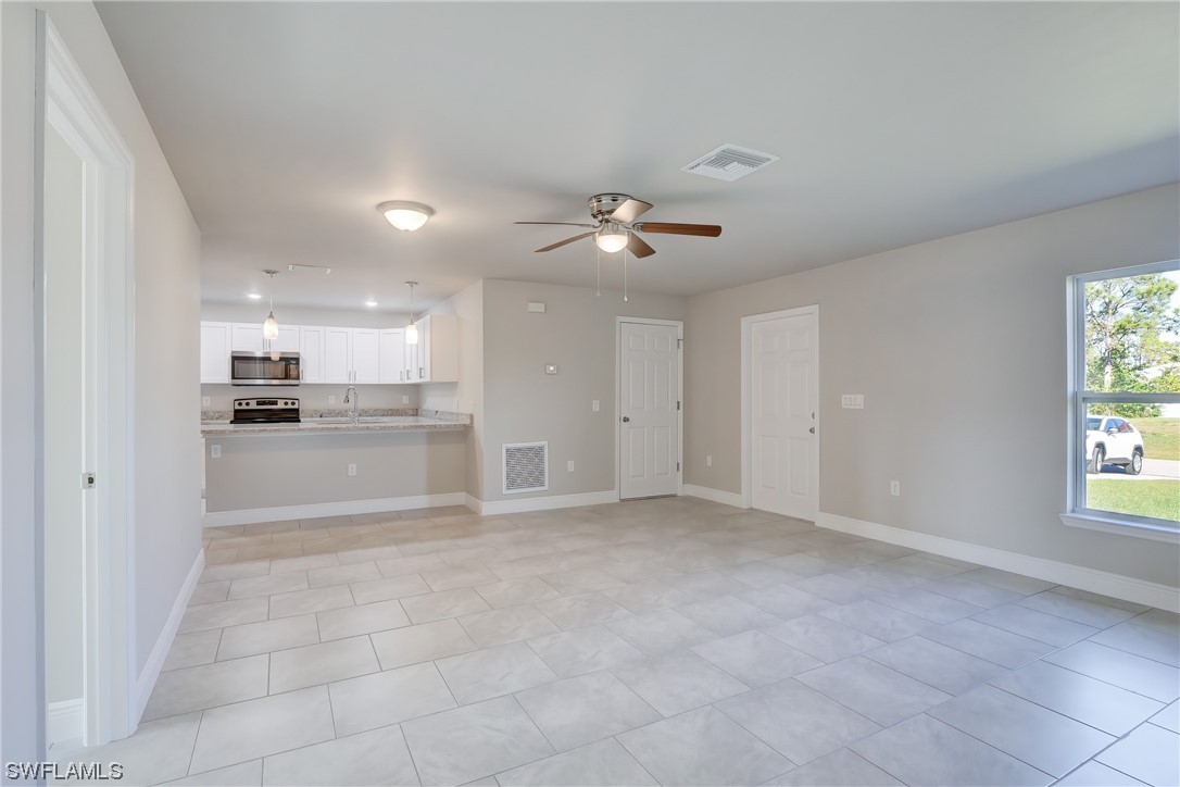 3215 46th Street West Lehigh Acres, FL 33971 - Photo 8 of 50 a view of kitchen with windows and cabinet