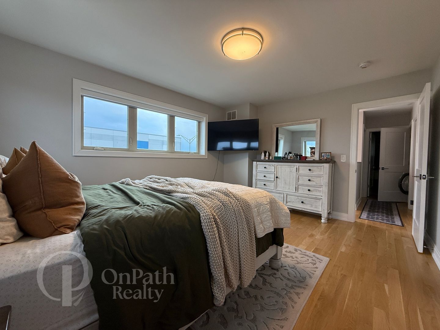 6834 West 65th Street, Unit 1 Chicago, IL 60638 - Photo 11 of 20 a bedroom with a bed and a dresser