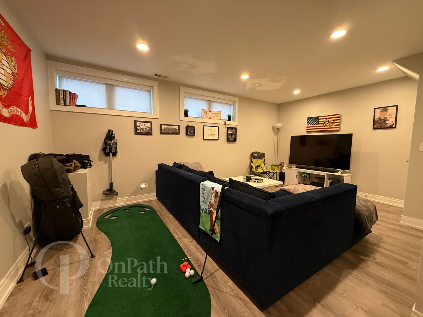 6834 West 65th Street, Unit 1 Chicago, IL 60638 - Photo 18 of 20 a living room with furniture and a flat screen tv