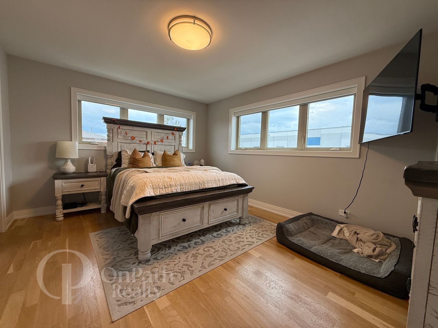 6834 West 65th Street, Unit 1 Chicago, IL 60638 - Photo 10 of 20 a bedroom with a bed and a window