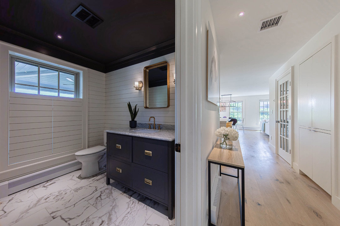 16 Somerset Road Nantucket, MA 02554 - Photo 15 of 30 a bathroom with a toilet a sink and mirror