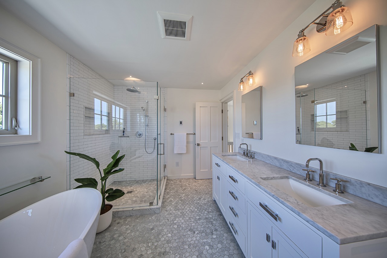 16 Somerset Road Nantucket, MA 02554 - Photo 17 of 30 a bathroom with a double vanity sink a mirror and a shower