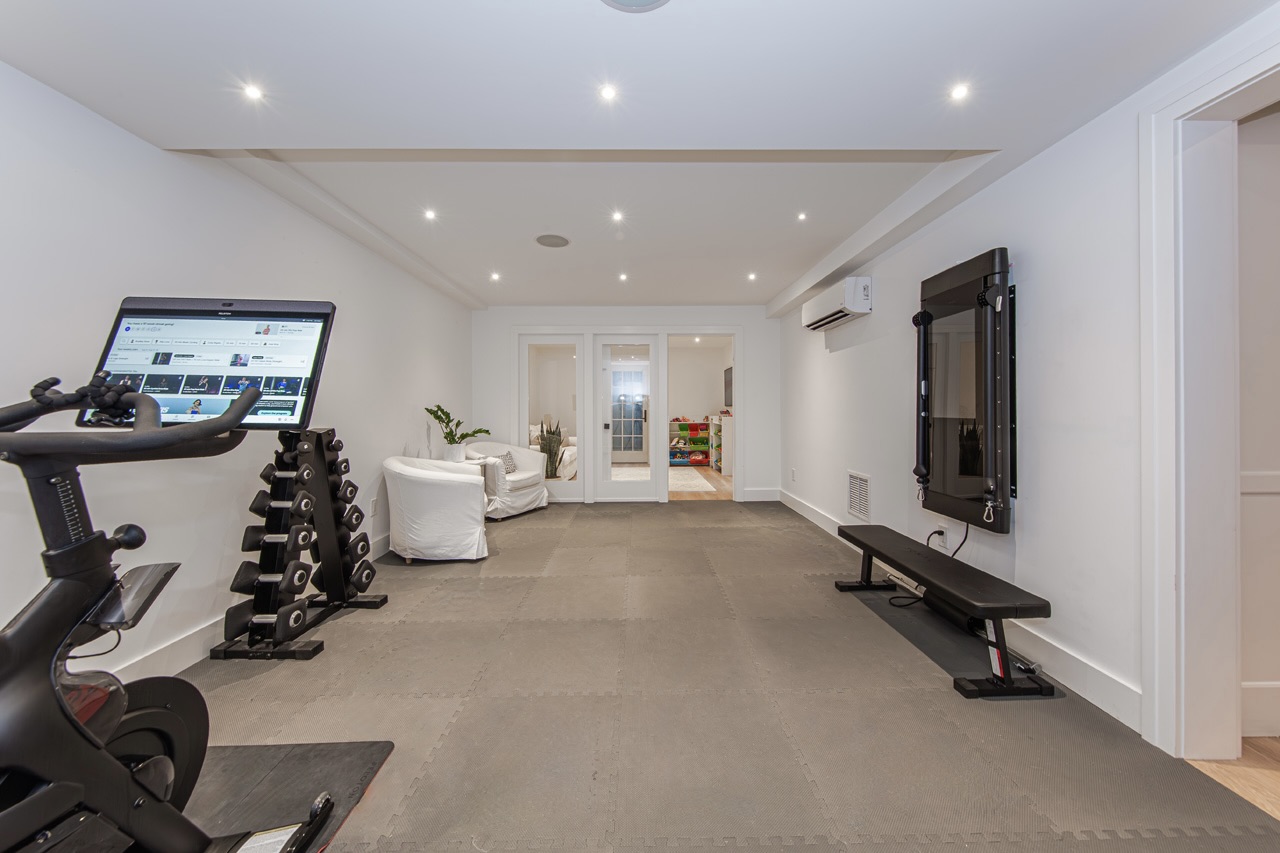 16 Somerset Road Nantucket, MA 02554 - Photo 24 of 30 a room with gym equipment and a flat screen tv