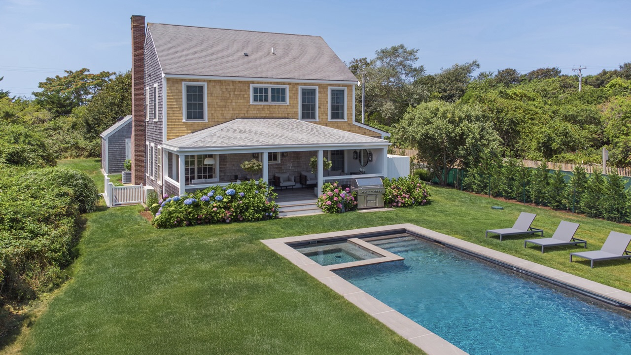 16 Somerset Road Nantucket, MA 02554 - Photo 28 of 30 a front view of a house with a yard table and chairs