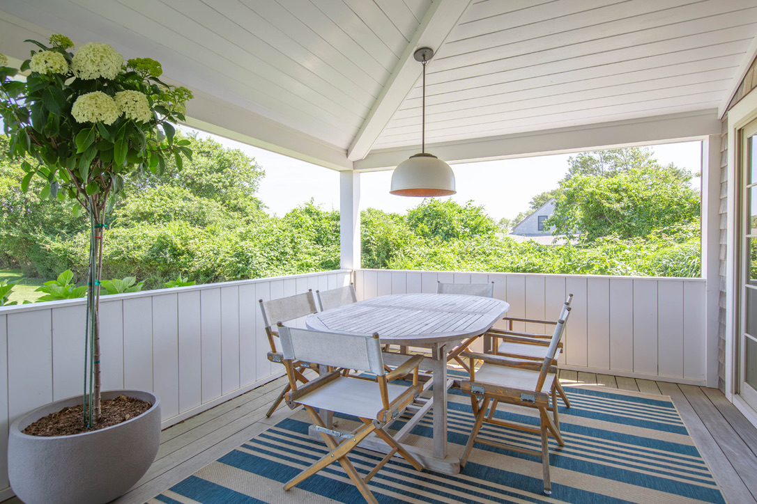 16 Somerset Road Nantucket, MA 02554 - Photo 6 of 30 a view of a table and chairs in patio of the house