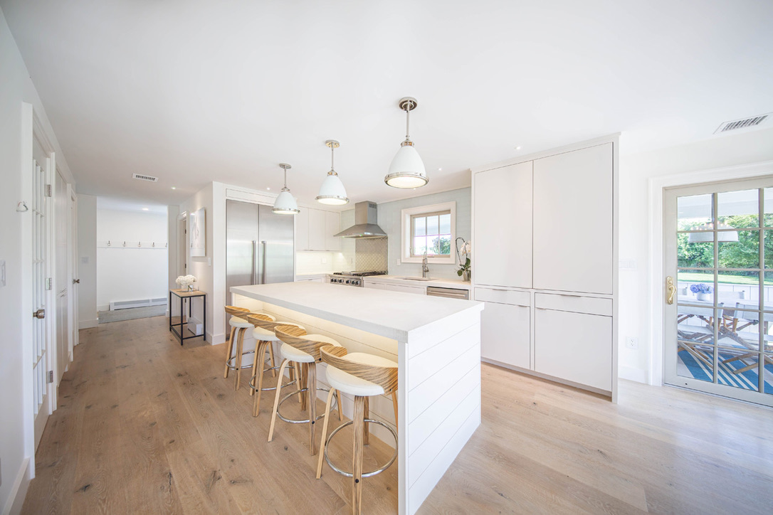 16 Somerset Road Nantucket, MA 02554 - Photo 9 of 30 a large kitchen with cabinets chairs and a chandelier
