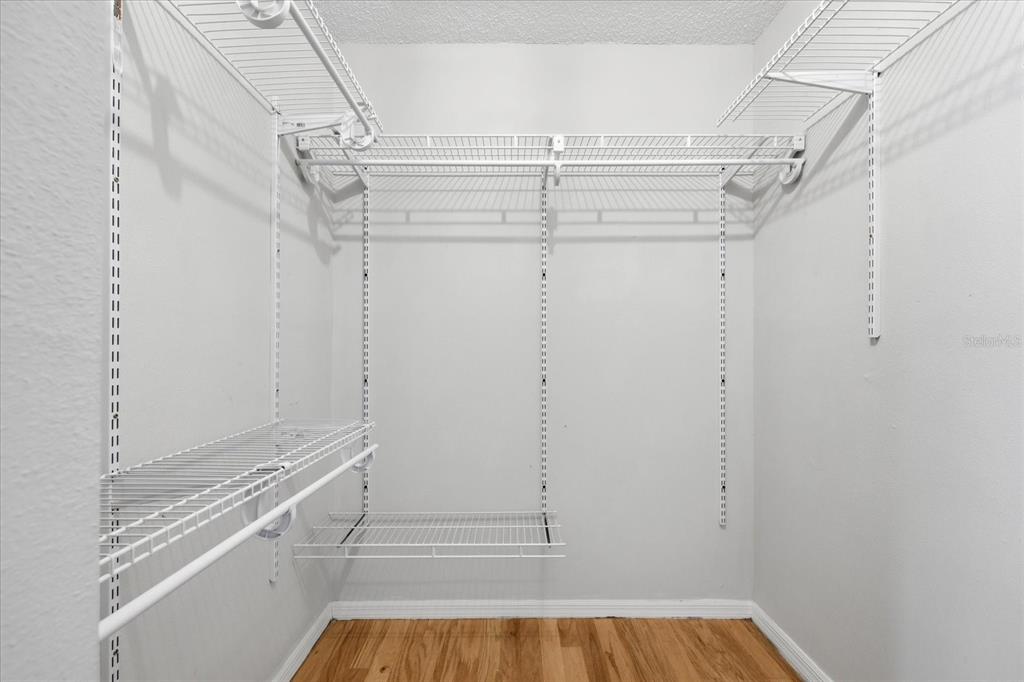 12836 Pineway Drive Largo, FL 33773 - Photo 15 of 28 a view of walk in closet with empty racks