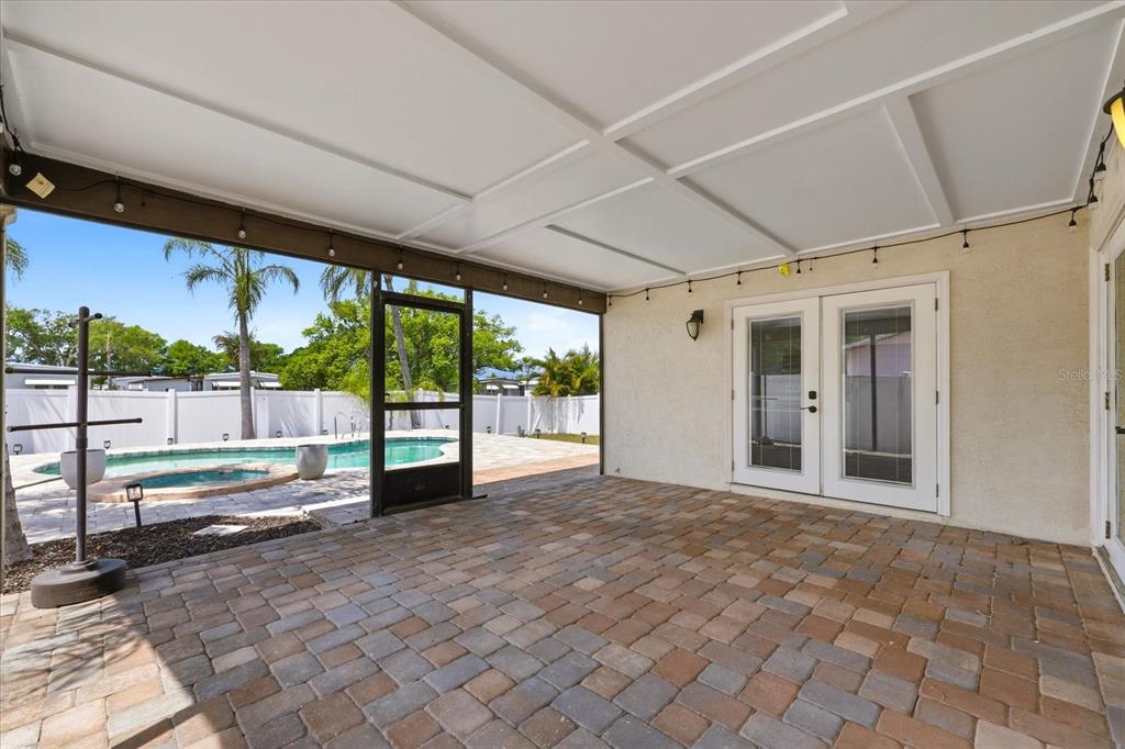 12836 Pineway Drive Largo, FL 33773 - Photo 20 of 28 a view of an empty room with a sliding door