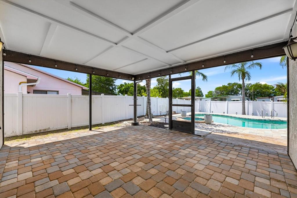 12836 Pineway Drive Largo, FL 33773 - Photo 21 of 28 a view of an empty room with a large window