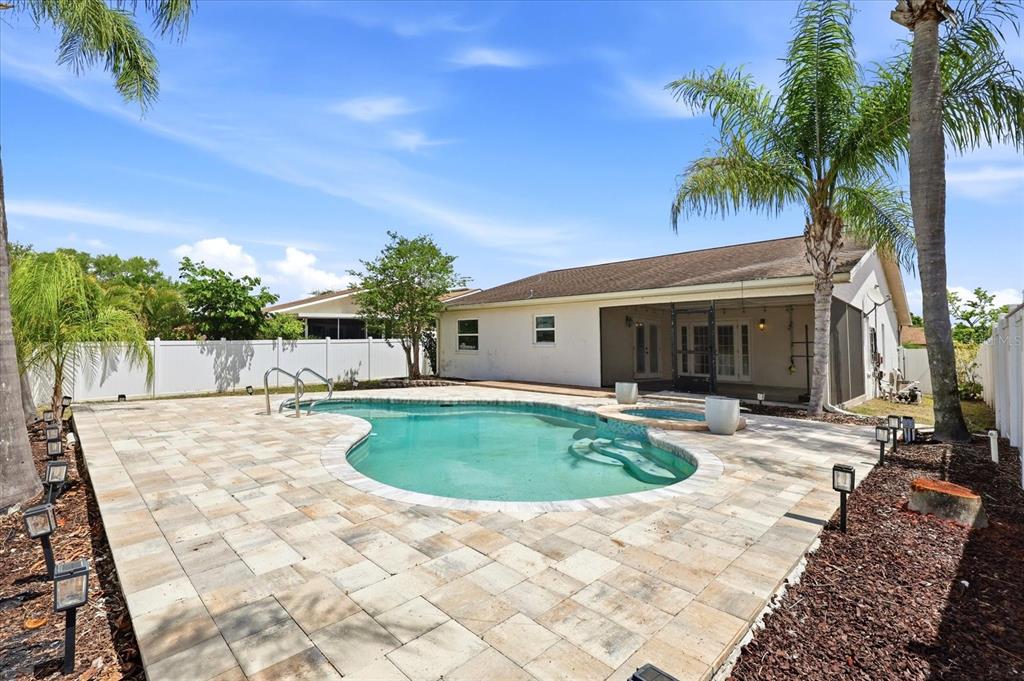 12836 Pineway Drive Largo, FL 33773 - Photo 24 of 28 a view of a house with swimming pool