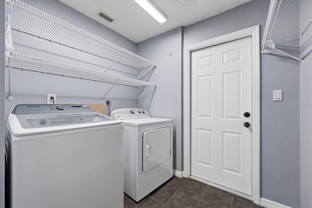 12836 Pineway Drive Largo, FL 33773 - Photo 26 of 28 a utility room with dryer and washer