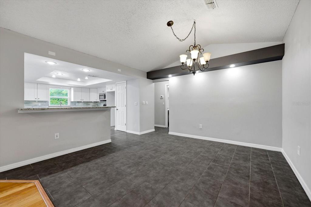 12836 Pineway Drive Largo, FL 33773 - Photo 8 of 28 a view of a kitchen with a sink and cabinet area