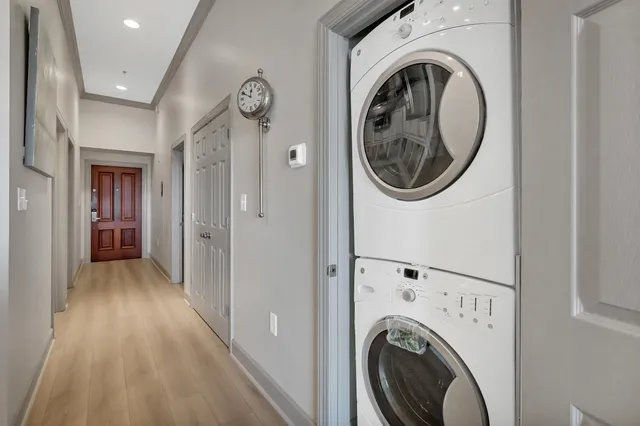a view of a hallway with washer and dryer
