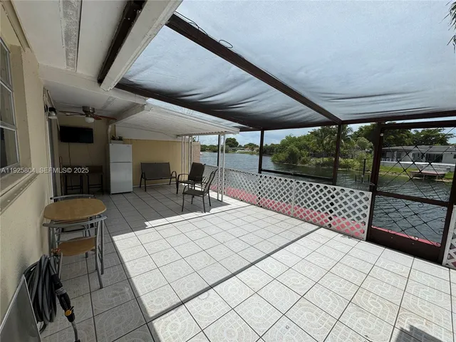 a outdoor space with lots of table and chairs