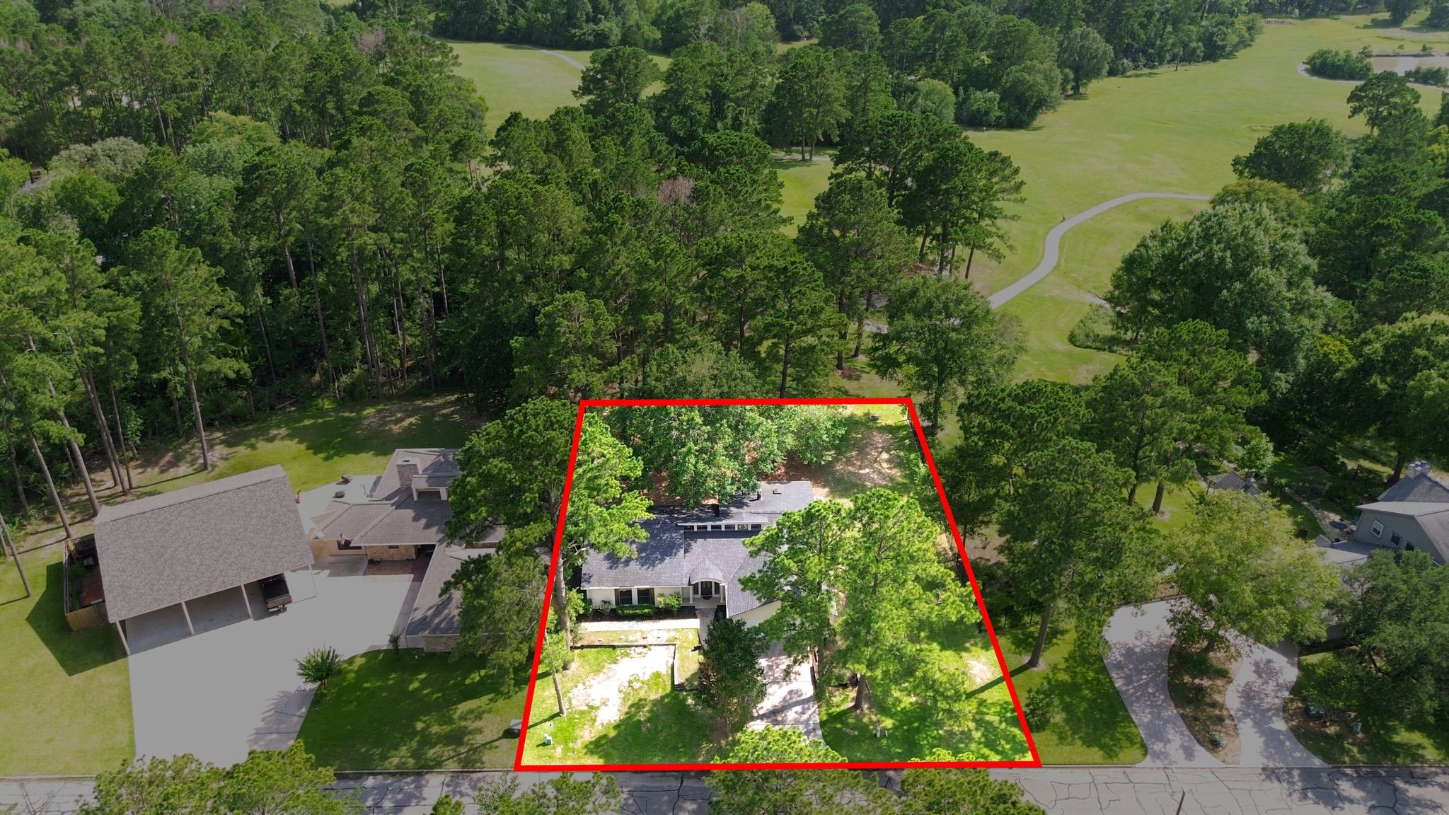 22509 Pebble Beach Way Point Blank, TX 77364 - Photo 30 of 30 Aerial of the home in its wooded, golf-course setting
