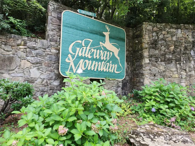 a sign that is on a brick wall