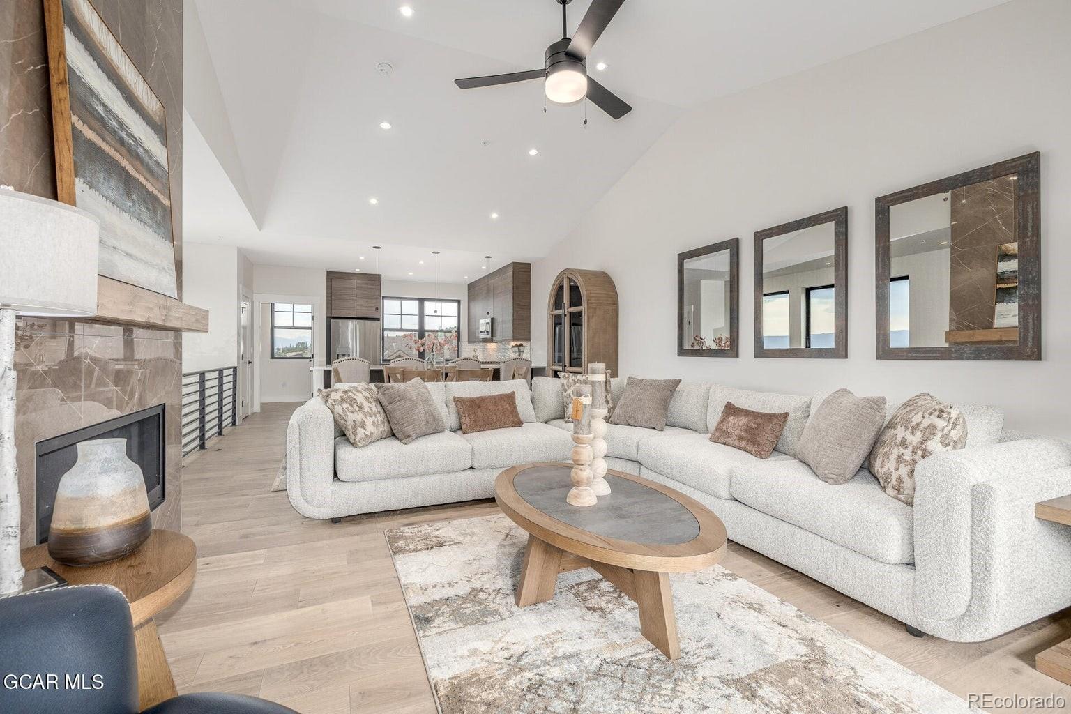 104 Saddle Mountain Camp Road Granby, CO 80446 - Photo 1 of 50 a living room with furniture and a fireplace