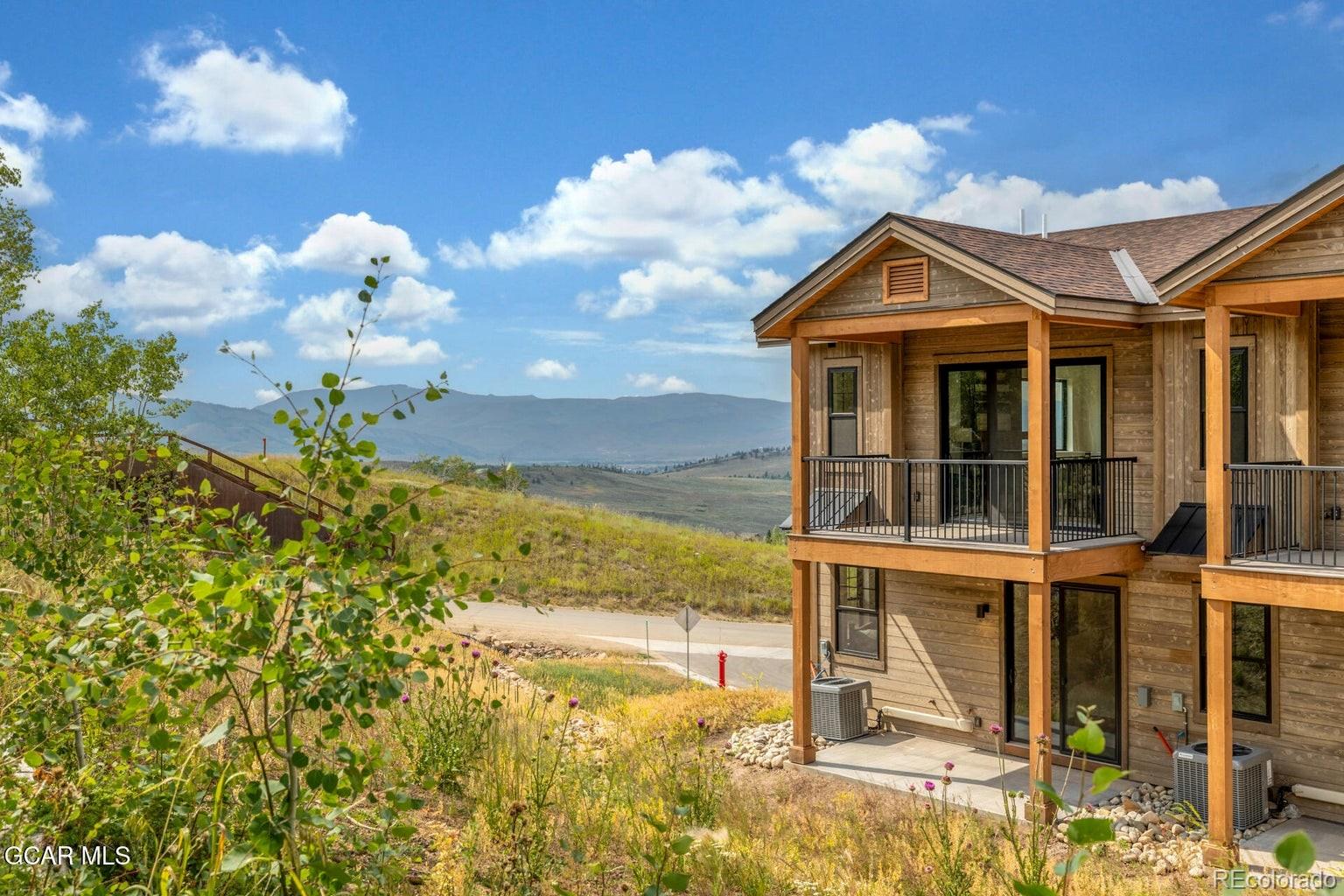 104 Saddle Mountain Camp Road Granby, CO 80446 - Photo 2 of 50 a view of a house with a yard