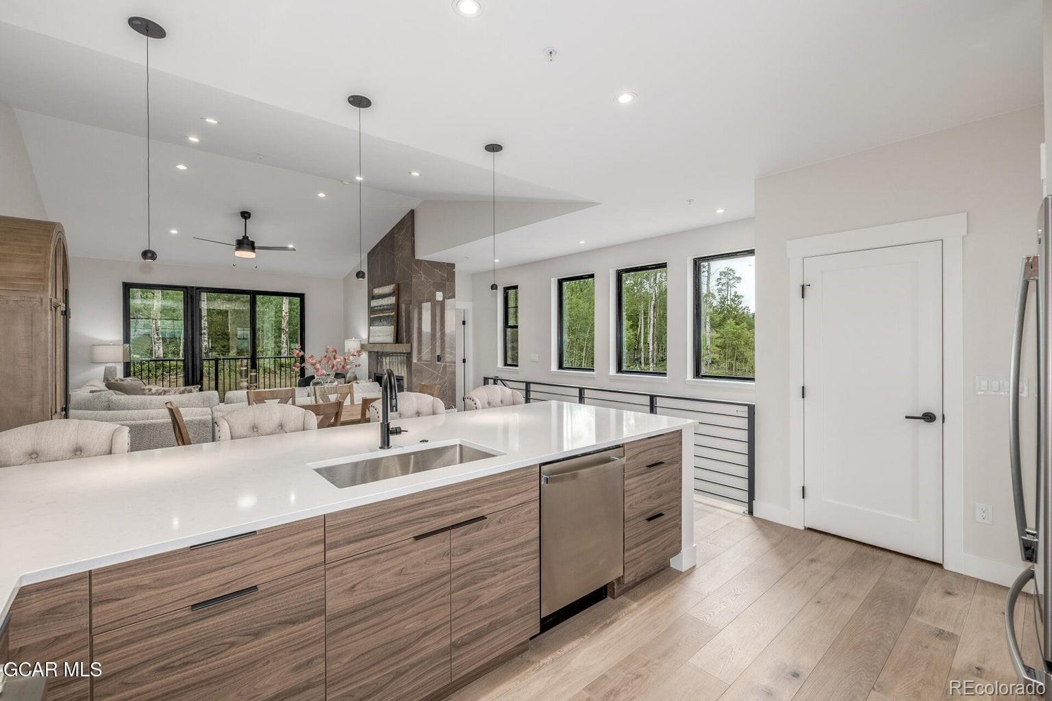 104 Saddle Mountain Camp Road Granby, CO 80446 - Photo 21 of 50 a large white kitchen with a large window