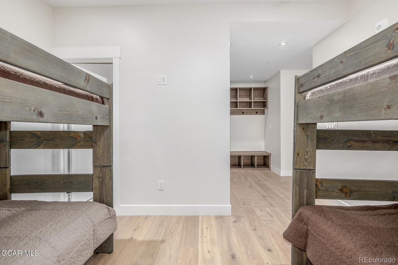 104 Saddle Mountain Camp Road Granby, CO 80446 - Photo 30 of 50 a bedroom with a bed and a view of living room