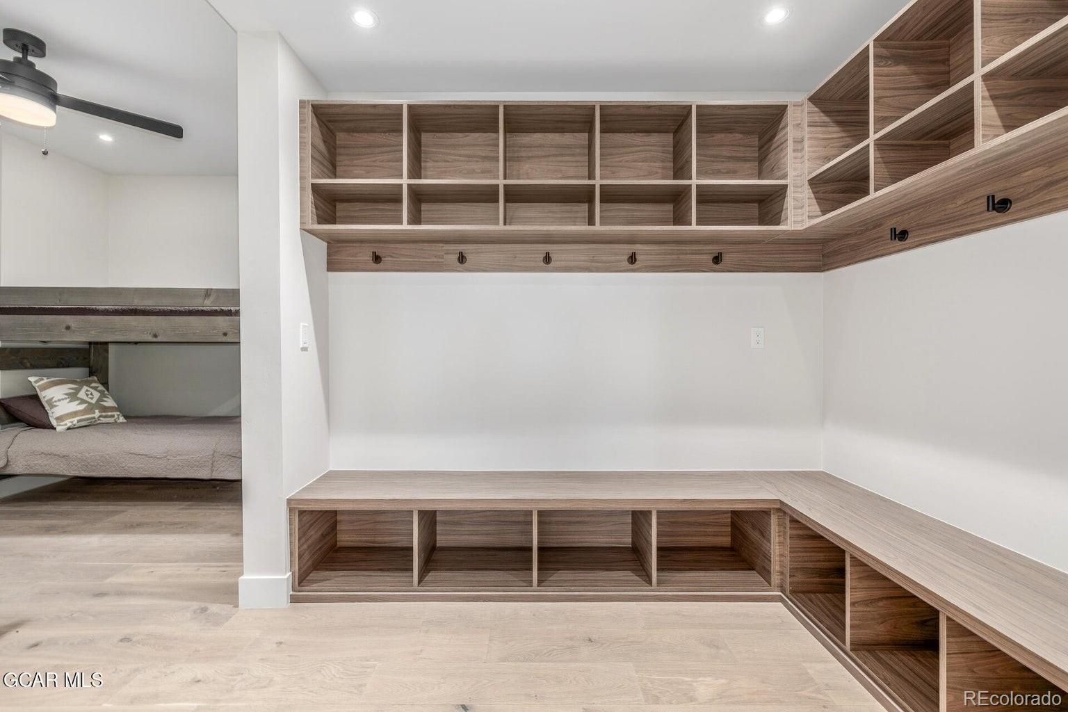104 Saddle Mountain Camp Road Granby, CO 80446 - Photo 39 of 50 a view of an empty room with wooden floor and windows