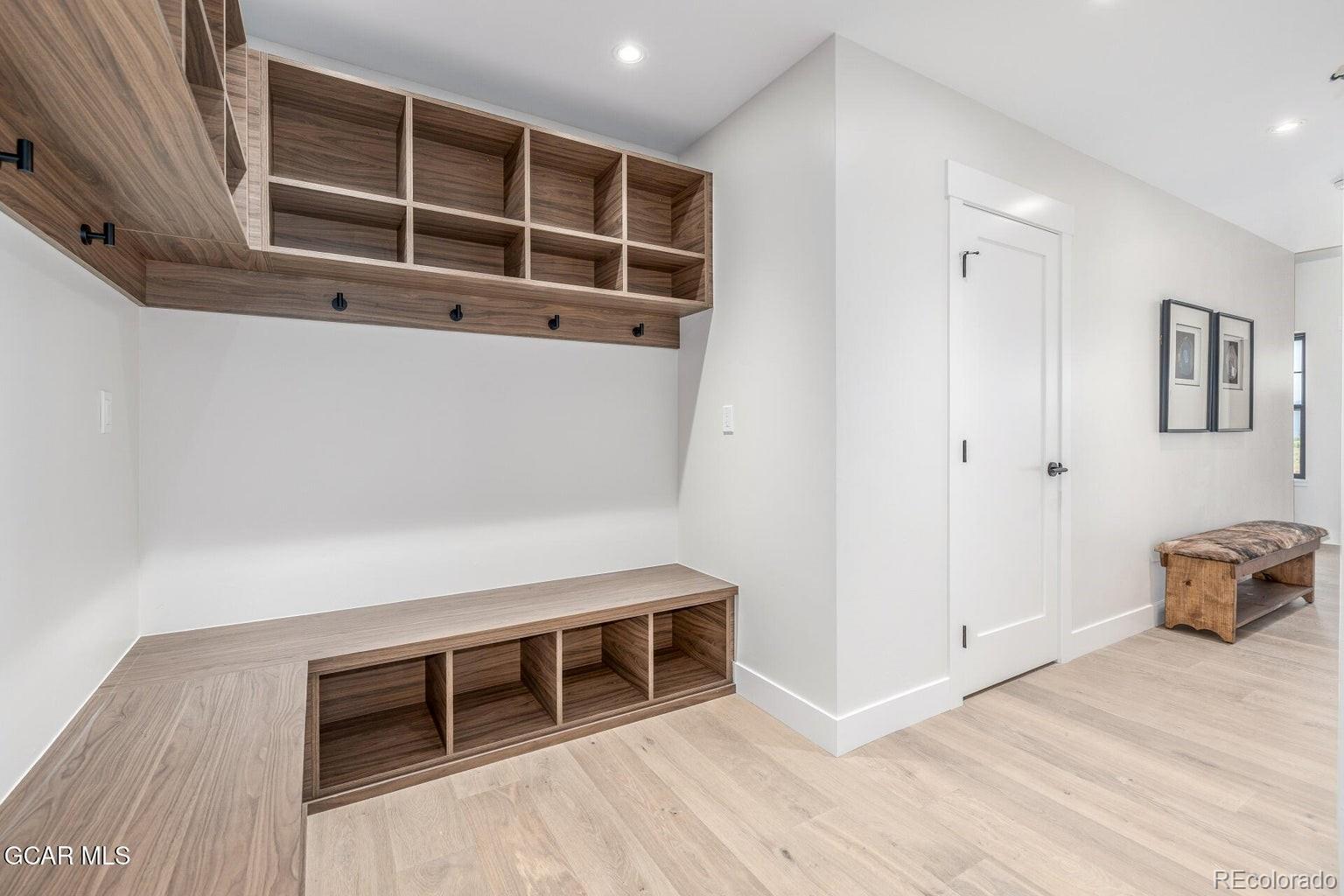 104 Saddle Mountain Camp Road Granby, CO 80446 - Photo 40 of 50 a view of an empty room with wooden floor and windows