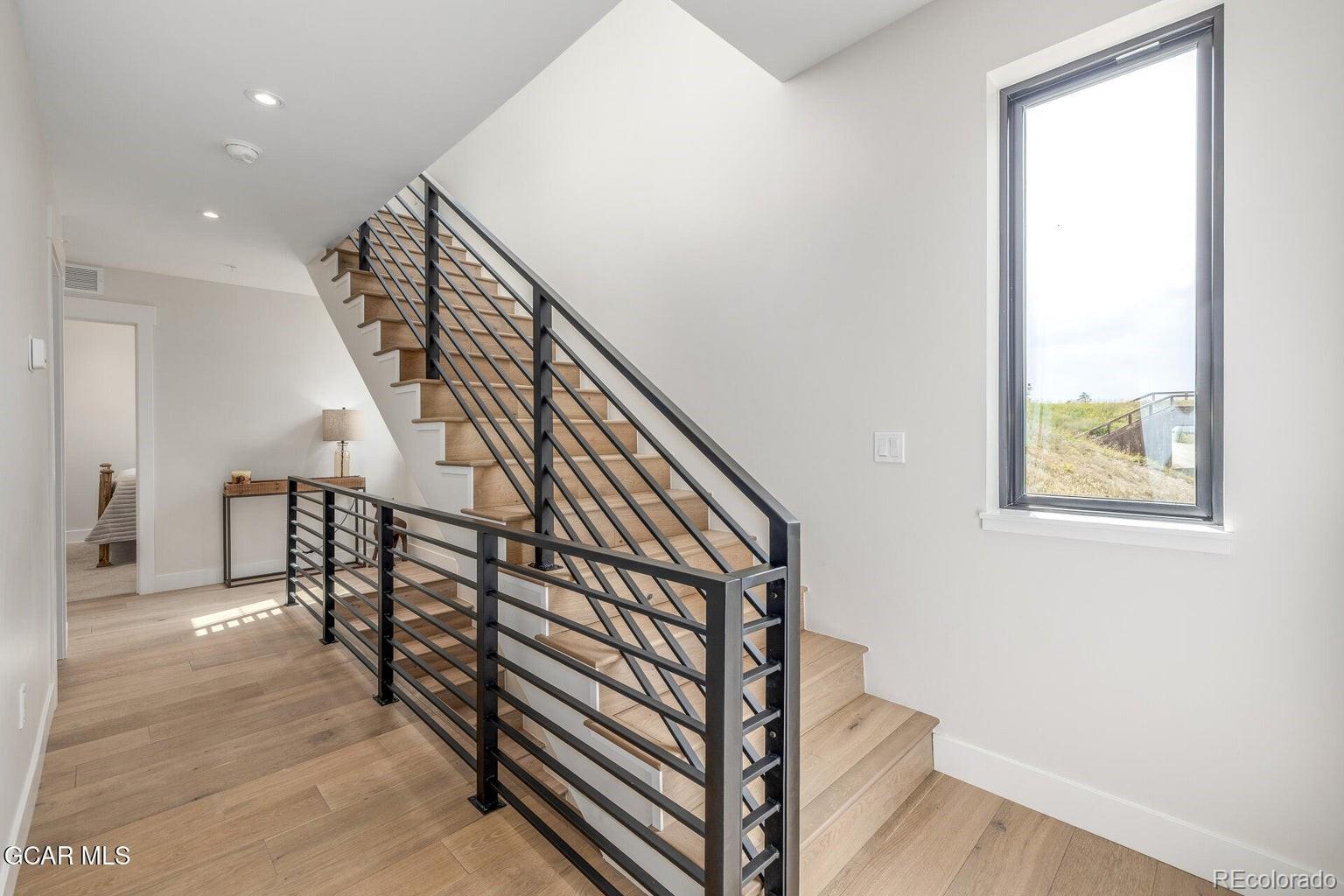 104 Saddle Mountain Camp Road Granby, CO 80446 - Photo 44 of 50 a view of entryway and hall with wooden floor