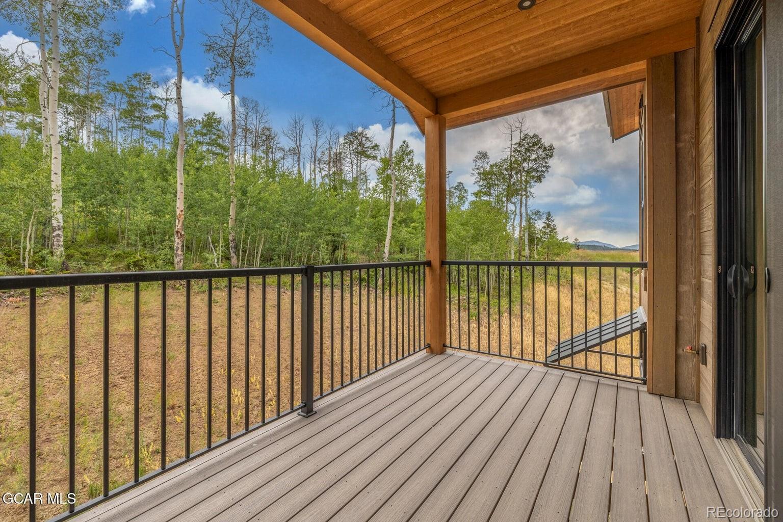 104 Saddle Mountain Camp Road Granby, CO 80446 - Photo 46 of 50 a view of a balcony with wooden floor