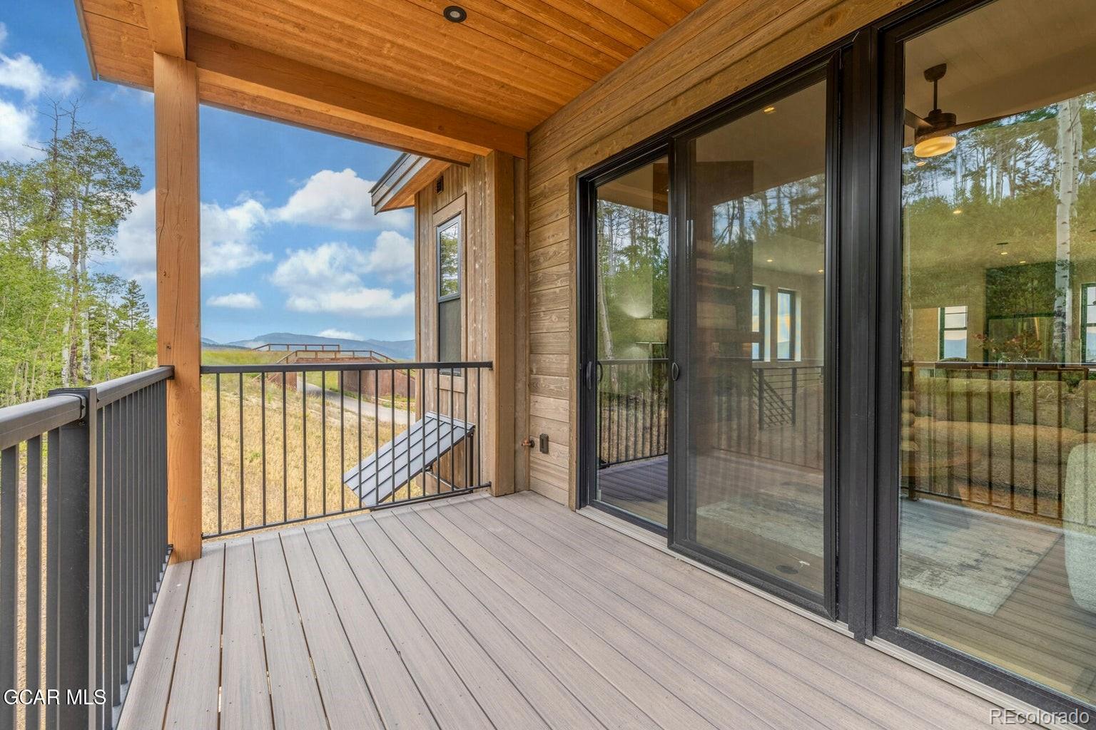 104 Saddle Mountain Camp Road Granby, CO 80446 - Photo 47 of 50 a view of a balcony with wooden floor